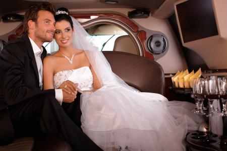 Bride & groom inside limo 