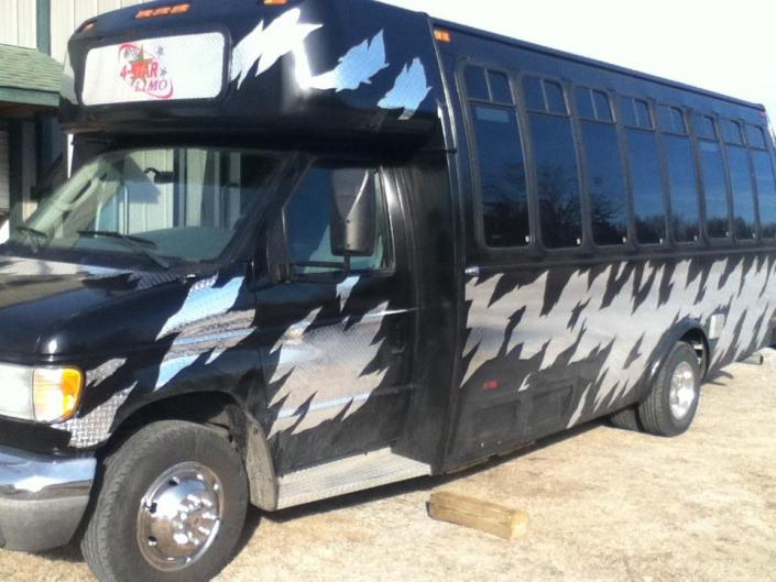 Arrive in style in our Black Party Limo Bus!